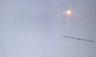 Rangers fans troll Celtic with 'can you see us now' banner flying over Tannadice