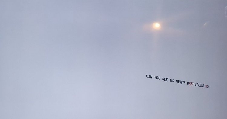 Rangers fans troll Celtic with 'can you see us now' banner flying over Tannadice